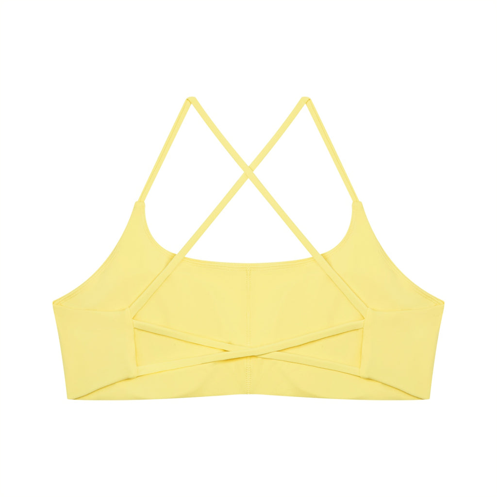 Anointed Garments yellow U-neck sports bra with a strappy crisscross back design in nylon spandex fabric.